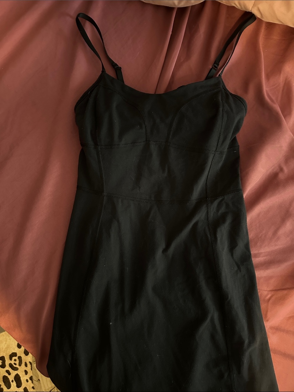 Black athletic dress with adjustable straps and built in bra